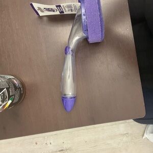 It is a 409 soap dispensing sponge brush